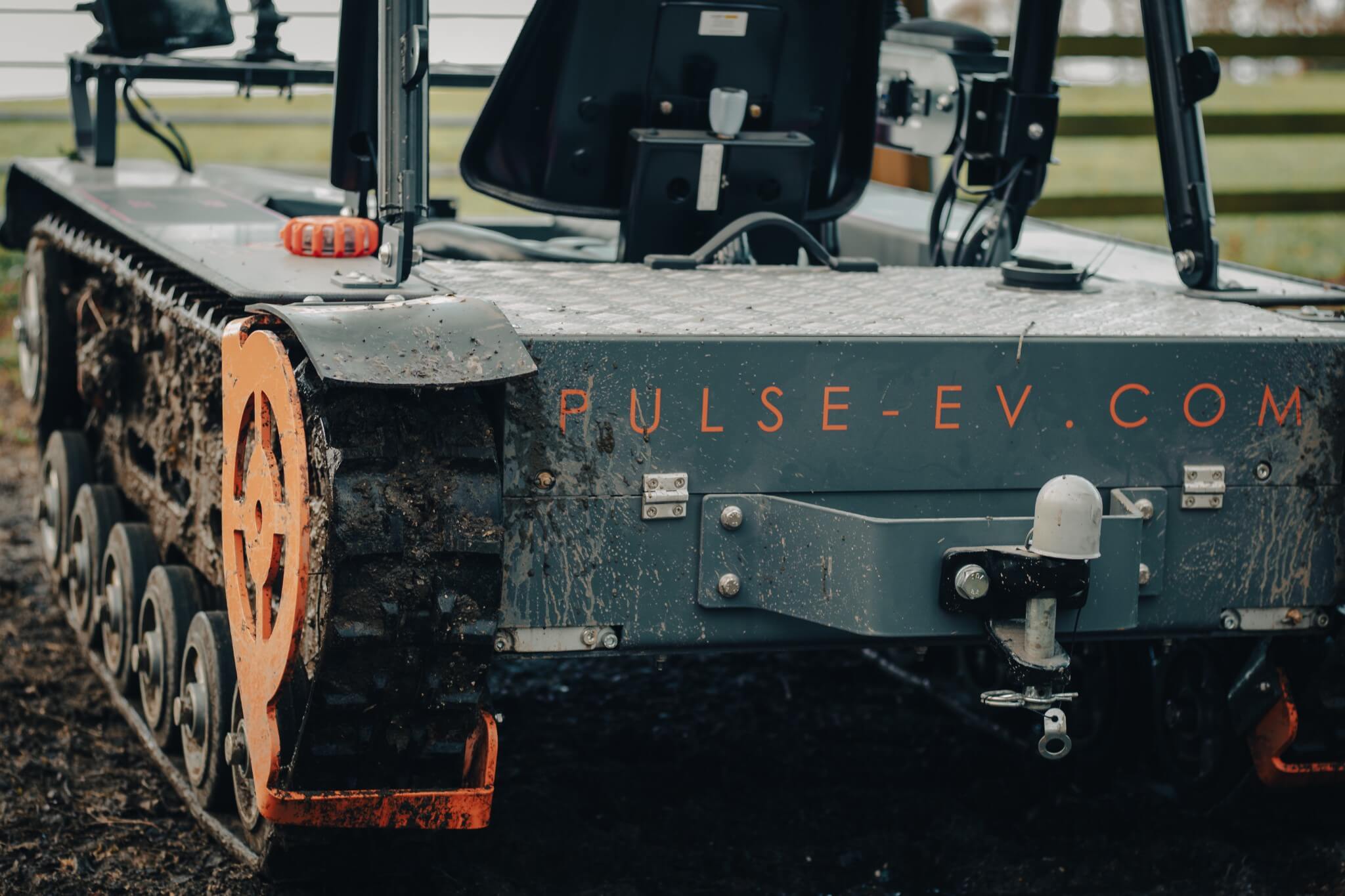 Rear shot of the Pulse-EV eTrak vehicle with Pulse-EV Logo